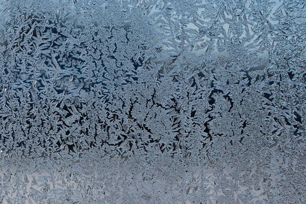 Winter background, frost on the window. Frosted glass