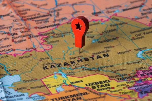 Red pin, point on the map of Kazakhstan. Concept travel background