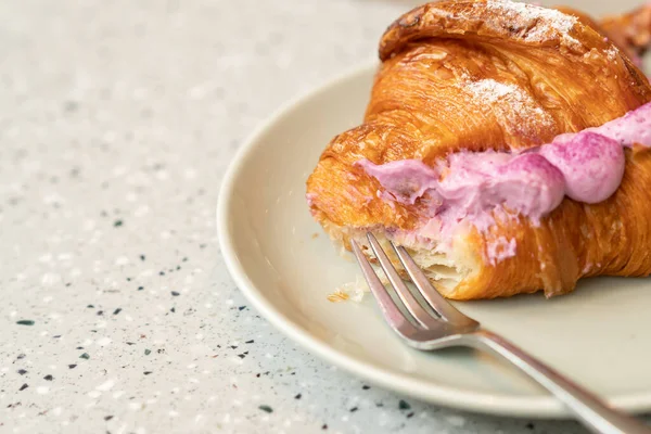 croissant with purple sweet potato. beautiful desserts in cafes.