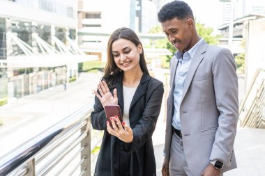 business people using smartphone to selfie. Happy interracial diversity business people with smartphone taking selfie or video call. successful business people taking a happy Selfie
