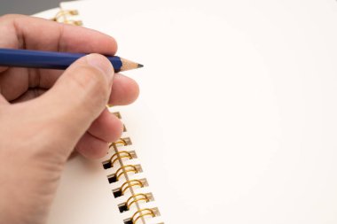 hand writing on the paper on desk office.