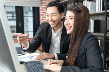 Business Corporate team brainstorming, Planning Strategy having a discussion Analysis investment researching with chart at office. Business meeting concept