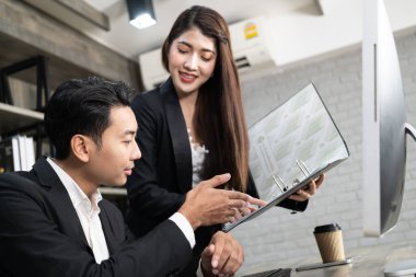 Business Corporate team brainstorming, Planning Strategy having a discussion Analysis investment researching with chart at office. Business meeting concept