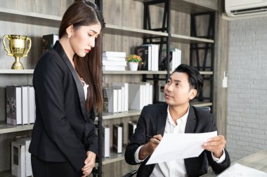 A male boss who pursues responsibility and a female businessman who receives power harassment. dissatisfied boss points on rude mistakes on report criticizing work scolding accusing  female employee