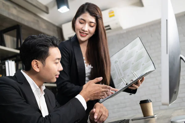 Business Corporate team brainstorming, Planning Strategy having a discussion Analysis investment researching with chart at office. Business meeting concept