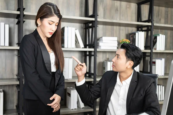 A male boss who pursues responsibility and a female businessman who receives power harassment. dissatisfied boss points on rude mistakes on report criticizing work scolding accusing  female employee