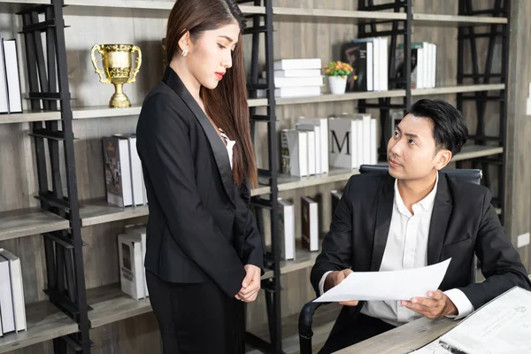 A male boss who pursues responsibility and a female businessman who receives power harassment. dissatisfied boss points on rude mistakes on report criticizing work scolding accusing  female employee