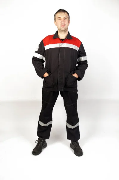 Ein Mann Overalls Und Arbeitskleidung — Stockfoto