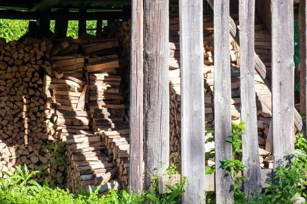 old wood shed with grass