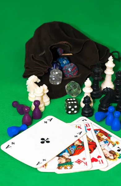 This picture shows collection of game figures and playing cards.