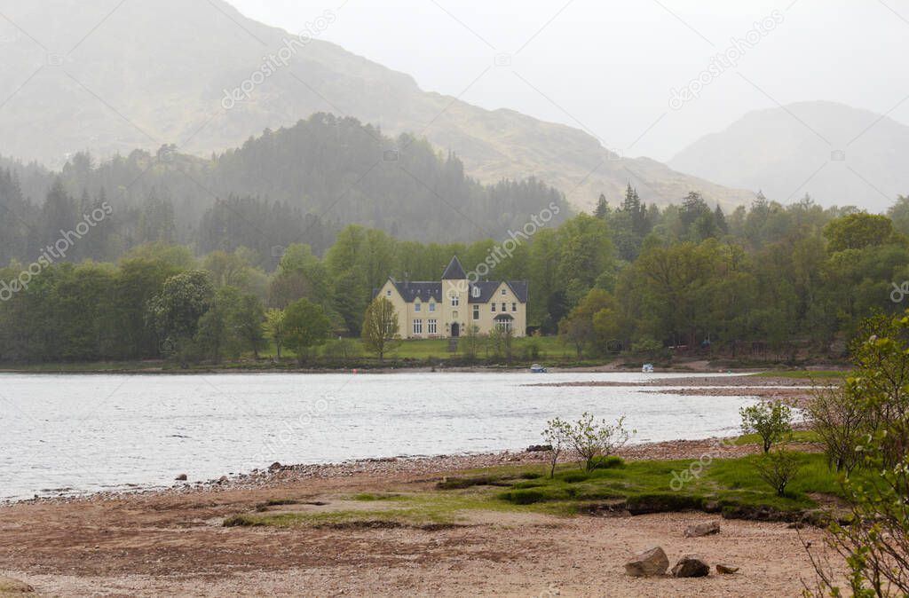 Loch Shiel is a freshwater lake in the Scottish Highlands. It is located in the Council Area Highland about 20 kilometers west of Fort William. This photo shows a manson during a rain shower