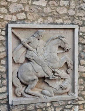 Buda Castle is the historical castle and palace complex of the Hungarian kings in Budapest. This photo shows the relief of St George and the Dragon.