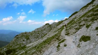 This aerial video shows the Kamnik-Savinja Alps in Slovenia. Captured on one of the highest peaks named Grintovec.