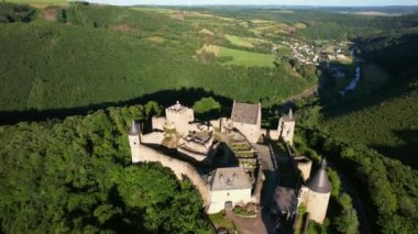Bourscheid Castle is located near the village of Bourscheid in the north of Luxembourg. It is a medieval castle dating back to Roman times, and it has a circular wall with multiple watch towers.