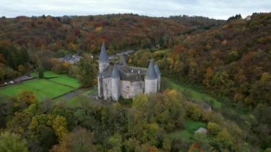 This is the Castle of Vves just outside the village of Celles, in the province of Namur, Belgium. It occupies a rocky platform in Wallonia, and is classified as a major heritage site.