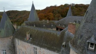 This is the Castle of Vves just outside the village of Celles, in the province of Namur, Belgium. It occupies a rocky platform in Wallonia, and is classified as a major heritage site.