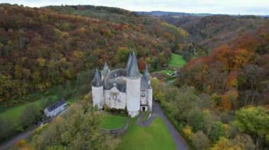 This is the Castle of Vves just outside the village of Celles, in the province of Namur, Belgium. It occupies a rocky platform in Wallonia, and is classified as a major heritage site.