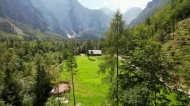 This is Logar Valley in Slovenia, and it is one of the most beautiful Alpine glacial valleys found in Europe. The valley is covered with rocky mountains and dense forests.