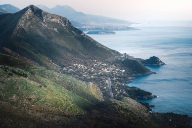 This is a photo of the beautiful coast near the Italian city of Maratea. The photo was taken from the viewpoint near the statue Christ the Redeemer, the third largest Jesus statue in Europe. The statue is as high as 22 meters.