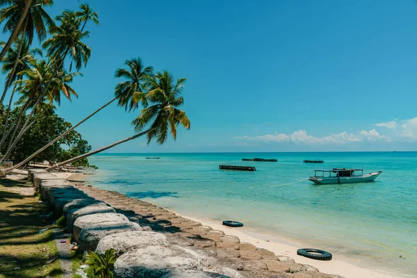 The beach at Biduk-Biduk, East Kalimantan, Indonesia With calm waves, clear blue water, rows of coconut trees and white sand that spoils the eyes of visiting tourists