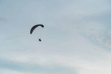 Powered parachute always adorns the sky of Parangtritis beach, Yogyakarta, Indonesia when the evening until the sun goes down, becoming an interesting spectacle for visiting tourists.