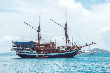 The uniqueness of tourism in Labuan Bajo, Indonesia is to live on the Phinisi Ship for several days to surround the small islands around Labuan Bajo which have beautiful views