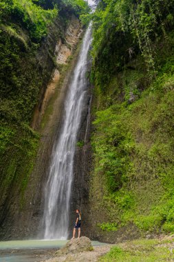 The beauty of Sidoharjo Waterfall, a straight waterfall that is 72 meters high surrounded by cliffs, is the tallest in the province of Yogyakarta, Indonesia