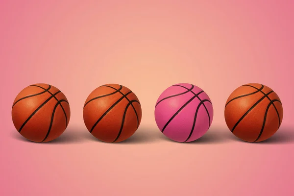 Basketball balls on a pink background. Pink baskettball. Minimal sports concept.