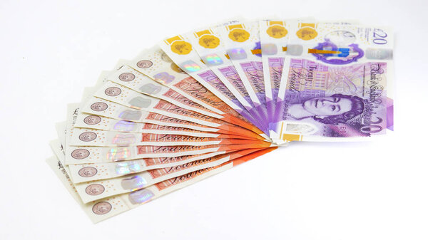 Stack of British 20 and 10 Pound Notes fanned out 200 total