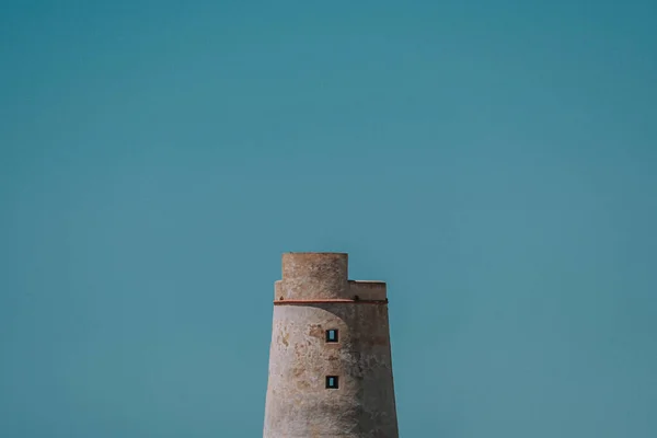 horizontal view of a lighthouse in the distance