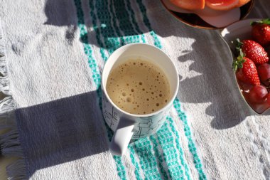 On the table in the restaurant strong and hot coffee. 