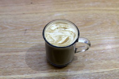 On the table in the restaurant strong and hot coffee. 