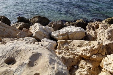 Large stones on the shore of the Mediterranean Sea 