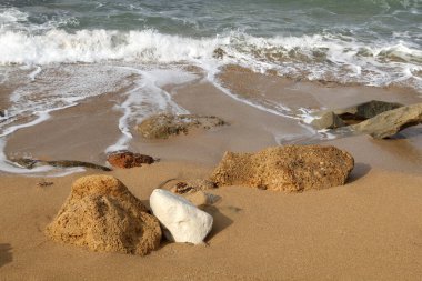 Large stones on the shore of the Mediterranean Sea 