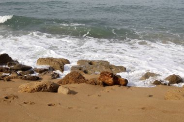 Large stones on the shore of the Mediterranean Sea 