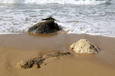 Large stones on the shore of the Mediterranean Sea 