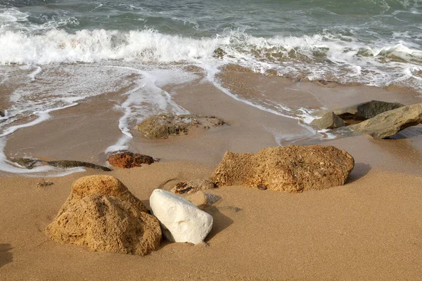 Large stones on the shore of the Mediterranean Sea 