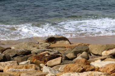 Large stones on the shore of the Mediterranean Sea 