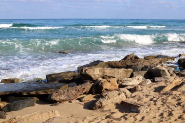 Large stones on the shore of the Mediterranean Sea 