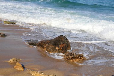 Large stones on the shore of the Mediterranean Sea 