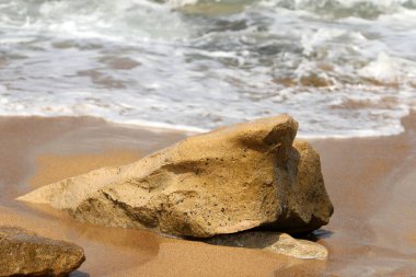Large stones on the shore of the Mediterranean Sea 