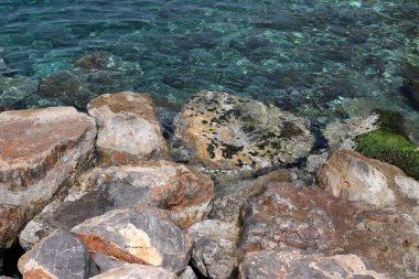 Large stones on the shore of the Mediterranean Sea 