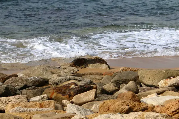 Large stones on the shore of the Mediterranean Sea 