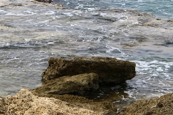 Large stones on the shore of the Mediterranean Sea 