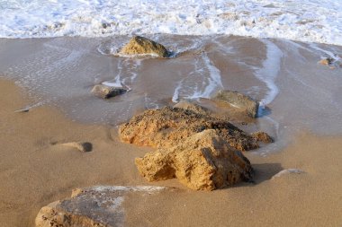 Large stones on the shore of the Mediterranean Sea 