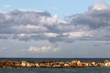 Rain clouds in the sky over the Mediterranean Sea. 