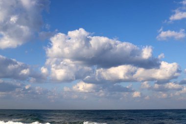 Rain clouds in the sky over the Mediterranean Sea. 