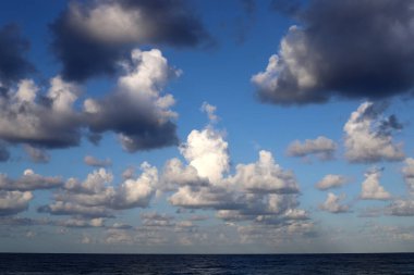 Rain clouds in the sky over the Mediterranean Sea. 