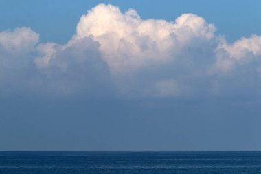 Rain clouds in the sky over the Mediterranean Sea. 