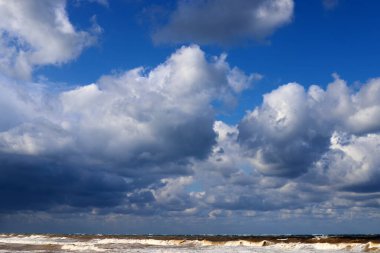 Rain clouds in the sky over the Mediterranean Sea. 